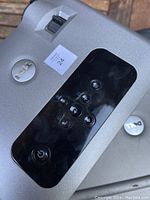 Close-up of Dell projector top panel with control buttons and Dell logo