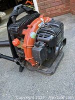 Side view of Echo backpack blower showing engine housing, frame and strap assembly
