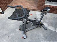 Side view of the NordicTrack exercise bike showing the frame, seat, pedals, and handlebars.