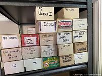 Metal shelving loaded with labeled cardboard boxes of various sports card sets: 1992 Ultra I, 1991 Topps, 1994 Donruss Series 1, 1991 Donruss Collector’s Set, 1988 Topps Set 2, 1988 Donruss, 1990 Donruss 1-716, 1990 Donruss BC1-26, 1992 Leaf, 1991–800 Upper Deck, 1991 Upper Deck, 1992 Upper Deck 1-700, 1992 Topps