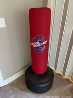 Front view of the red Wavemaster training bag with black base, showing brand logo.