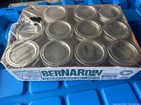 Pack of 11 Bernardin decorative mason jars in original packaging showing tops of jars