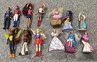 Top view showing all 13 small collectible doll figures