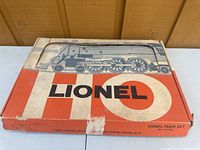 Original Lionel box with wear, tape marks, and train illustration on top.