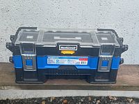 Closed Mastercraft tool or craft box showing blue and black plastic with transparent lid and metal clasps.