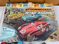 Top view of the original colorful vintage box with racing car art and Strombecker Road Racing branding.