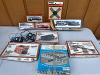 Full view of all trains and accessory sets with original boxes displayed.