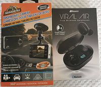 Front view of Armor All dashboard camera box and 2Boom Viral Air earphones box side by side showing product images and branding.