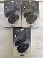 Three unopened boxes of 2Boom Viral Air True Wireless Earbuds placed on a white textured surface.