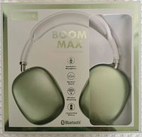 Fisher Boom Max wireless headphones front view in packaging showing headphone and branding