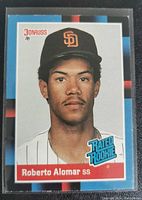 Front of Roberto Alomar 1989 Donruss Rated Rookie baseball card showing player portrait, team logo, and Rated Rookie emblem.