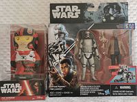 Two Star Wars collectible figures still sealed in original packaging, showing both items in full view.