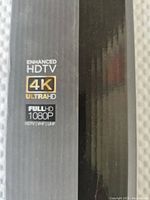 Close-up of box showing Enhanced HDTV 4K Ultra HD and Full HD 1080p logos
