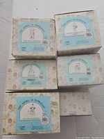 Five original boxes of Precious Moments figurines from the 'School of Mousekewitz' series with titles visible