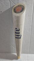 Full side view of the white wooden baseball bat shaped tap handle with blue 'Lite' logo, showing overall condition and size.