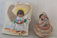 Pair of Mexican pottery items: votive holder with child figure and trinket box with seated person figurine lid