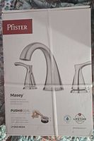Front of original packaging showing Pfister logo, faucet set image, and model number LF-049-MCKK. Description of brushed nickel finish and Push & Seal design.