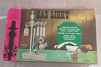 Photo of the vintage Gaslight Bar Tool Set box showing product image and features