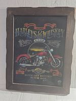 Full view of the framed glass sign featuring Harley-Davidson motorcycle and whiskey themed text and graphics.