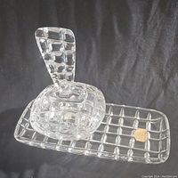 Close-up of vintage Hofbauer glass trinket dish with loop handle on rectangular tray, both featuring checkered pattern design.