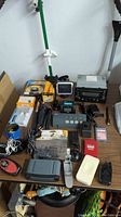 Full view of electronics lot items on a table