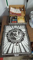 Marketing pack displayed with large Night Watch poster with bear emblem and box with assorted items