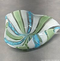 Front and top angled view of the Murano twisted robins art glass bowl showing the colorful twisted cane pattern in shades of blue, green, and white.