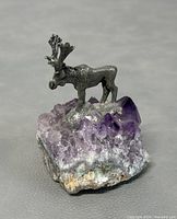 Front view of the pewter moose on amethyst crystal geode, showing detailed moose features and purple crystals.
