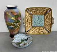Photo showing three items: Nippon hand-painted vase, Italian signed square serving dish, and leaf-shaped decorative dish.