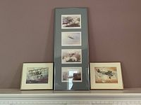 Full view of the three framed art pieces including a tall vertical frame with four prints and two smaller frames with single aircraft paintings.