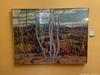Full front view of framed landscape print hanging on wall