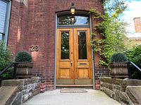 Front elevation showing both planters flanking entry steps