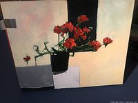 Front view of oil on canvas painting depicting red geraniums in a black pot on geometric blocks against an abstract background