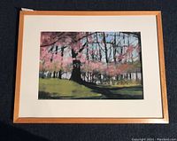 Framed artwork front view showing full cherry tree landscape, cream mat and light wood frame