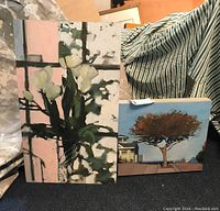 Overview of two oil on board panels: vertical floral panel and tree landscape panel