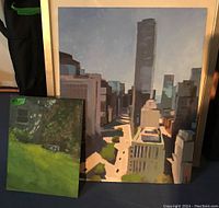 Photo of both paintings together showing size difference and context