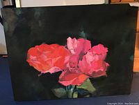 Front view of oil painting of pink and red roses on canvas with dark background.