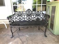 Front view of full bench showing harp back design and lattice seat