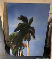 Front view of oil painting showing full composition of palm trees against blue sky.