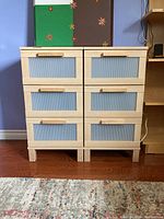Front view of both nightstands side by side on hardwood floor.