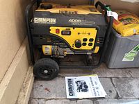 Generator front and frame showing control panel, wheels and manual beneath