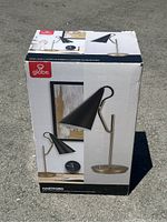 Photo of the boxed Globe Hartford desk lamp showing product image on front of box
