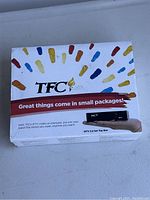 Box of TFC IPTV 2.2 Set Top Box showing colorful brush stroke design and slogan.