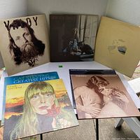 Photo showing 7 vintage vinyl LP albums on a white table including Valdy, Carole King, Joni Mitchell, Cat Stevens, Barbra Streisand & Kris Kristofferson, Murray McLaughlan