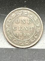 Reverse of the 1859 Canadian Large Cent showing denomination and date with maple leaf wreath.