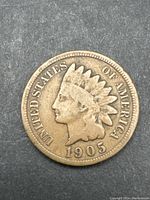 Obverse side of the 1905 Indian Head penny showing the portrait of the Native American figure and the date with surrounding text.