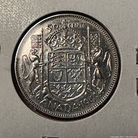Reverse view showing the Canadian coat of arms and coin denomination/date.