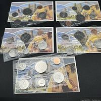Five sealed Canadian proof-like coin sets from 1980-1984 in original cellophane packaging showing six coins each with accompanying background papers.