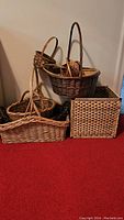 Photo showing a variety of baskets in different sizes and shapes, including rectangular, round, and square with handles