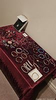 Full assortment on velvet cloth including bracelets, rings, necklaces and brooches